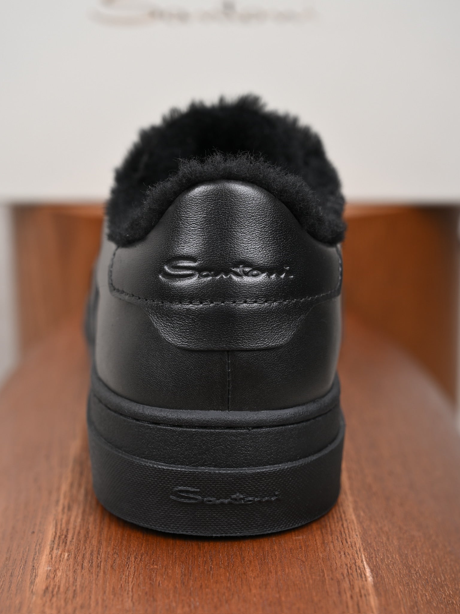 Santoni Leder-Sneaker mit Lammfellfutter in Schwarz